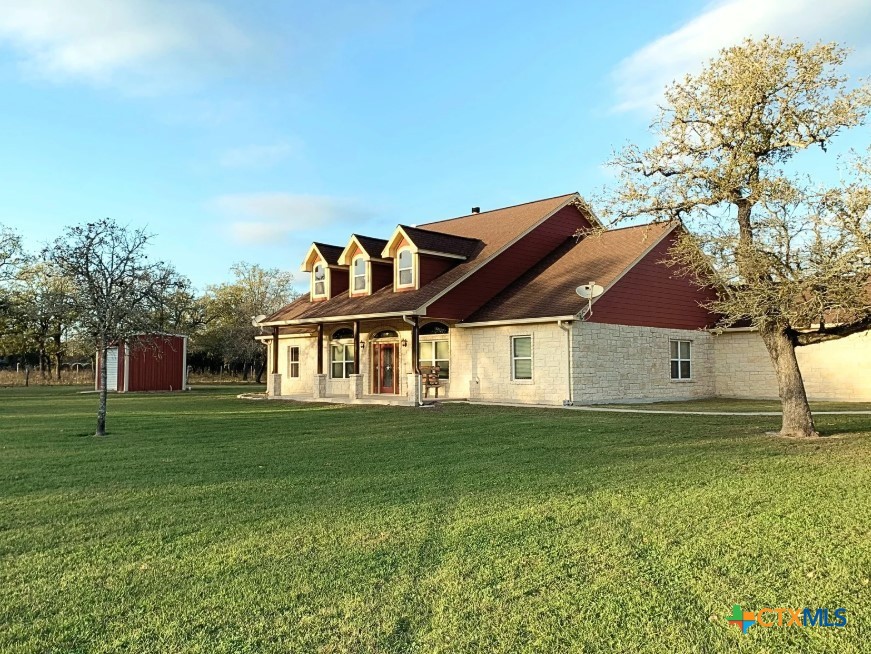 949 Abrameit Road Goliad, TX 77963 - Photo 5 of 30 a front view of a house with a garden