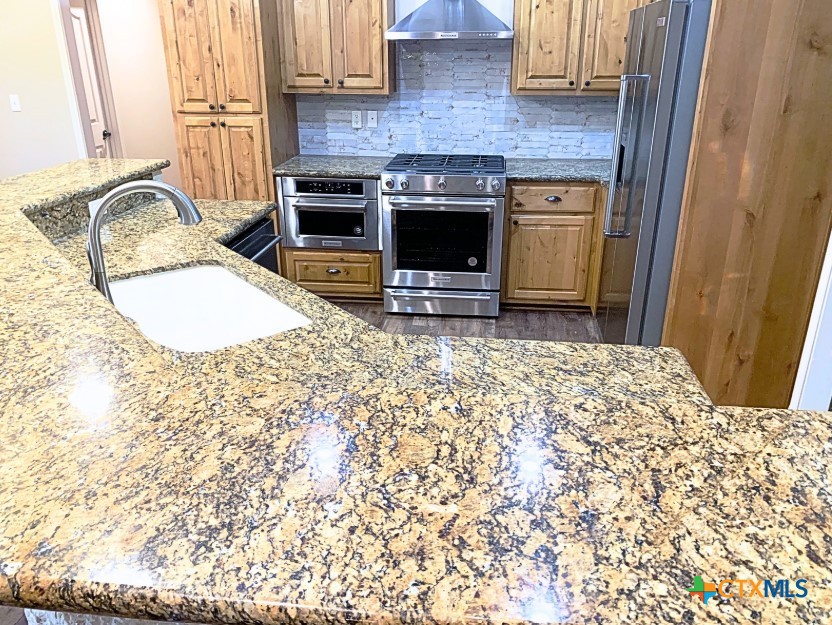 949 Abrameit Road Goliad, TX 77963 - Photo 10 of 30 a view of kitchen with sink oven and window