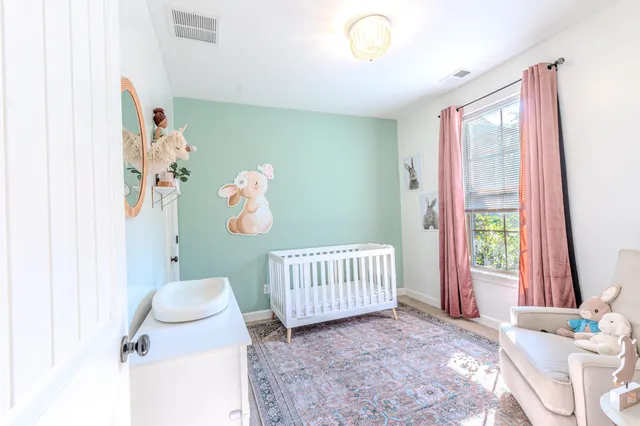 a bedroom with furniture and a window