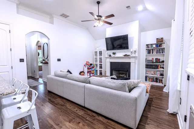 a living room with furniture and a flat screen tv