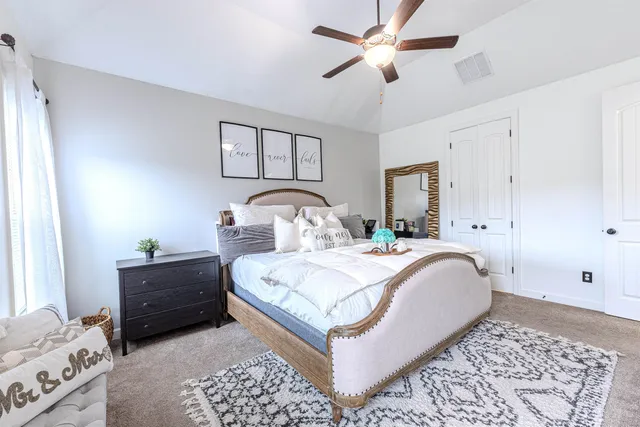 a bathroom with a granite countertop sink mirror toilet and bathtub