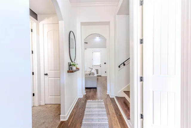 a view of a hallway with a white walls