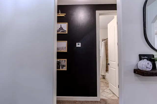 a view of a bathroom from a hallway