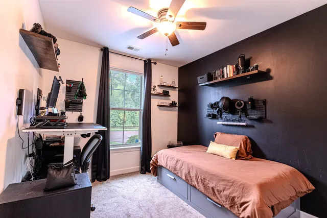 a bathroom with a granite countertop sink toilet a mirror and shower