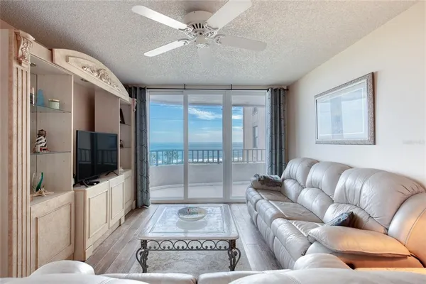 a living room with furniture and a large window