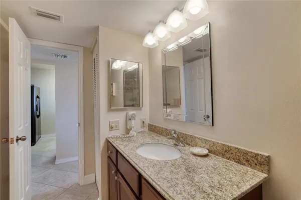 a utility room with a refrigerator a washer and dryer