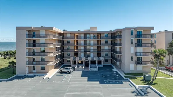 a view of a buildings with many windows