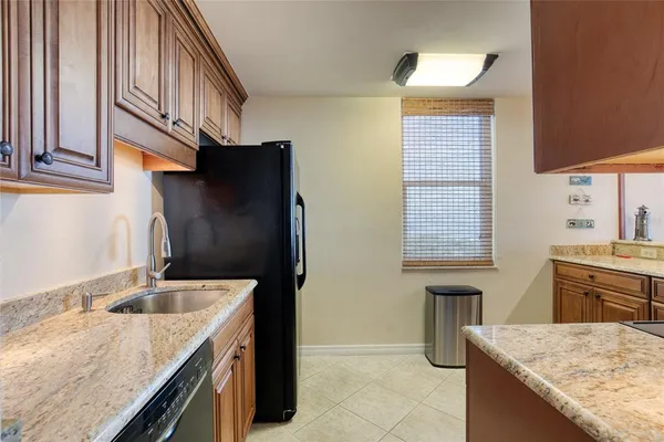 a kitchen with a stove and a sink