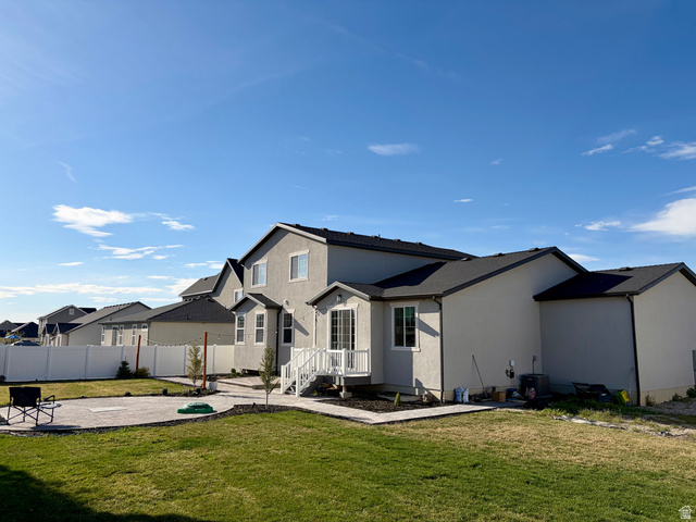 3359 Eurasian Crane Road Clinton, UT 84015 - Photo 60 of 71 Back of property featuring a patio area, stucco siding, and a residential view