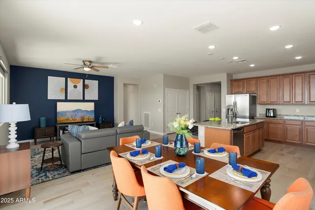 a kitchen with refrigerator a microwave and cabinets