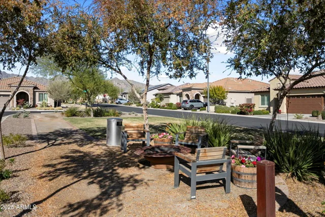 a living room with fireplace furniture and a floor to ceiling window