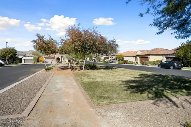 a living room with patio furniture and a flat screen tv