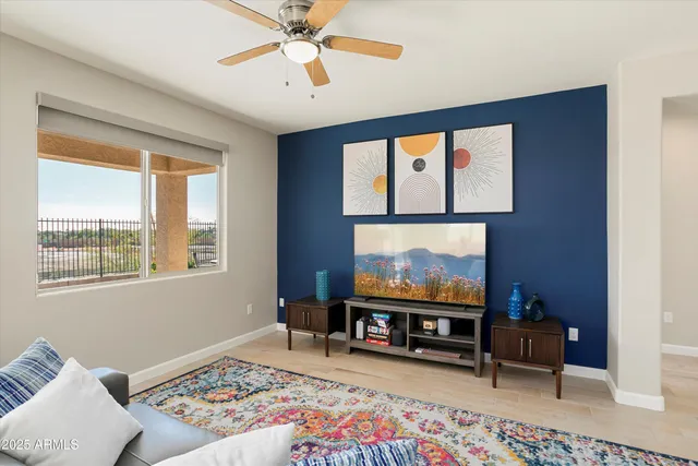 a living room with a couch a rug and a flat screen tv