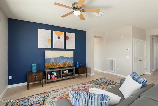 a living room with furniture kitchen and a window