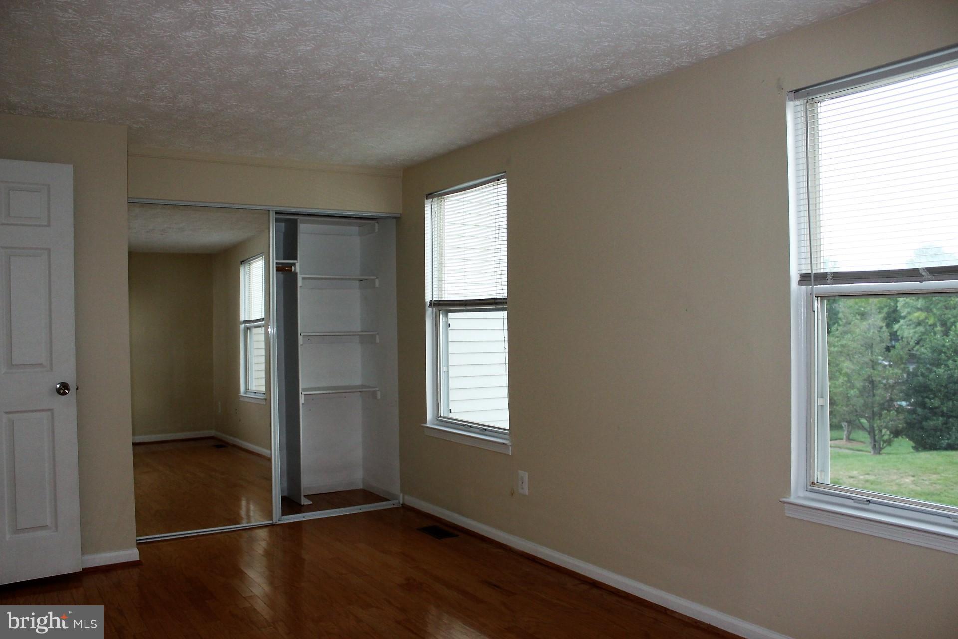 12107 Sundance Court Reston, VA 20194 - Photo 8 of 19 Master bedroom with hardwood flooring