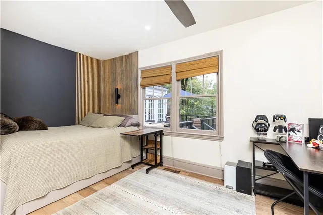 a bedroom that has a bed and a table in it