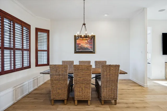 a view of dining room and wooden floor