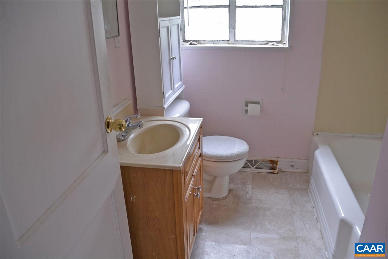 1110 Osborn Road Farmville, VA 23901 - Photo 5 of 9 a bathroom with a granite countertop toilet and a sink