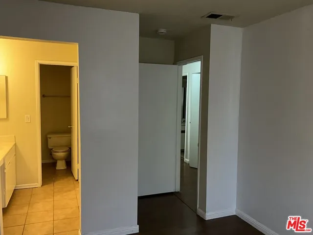 a view of a bathroom from a hallway