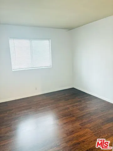 a white toilet sitting next to a shower curtain
