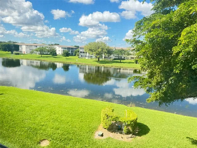 a view of a lake with a yard