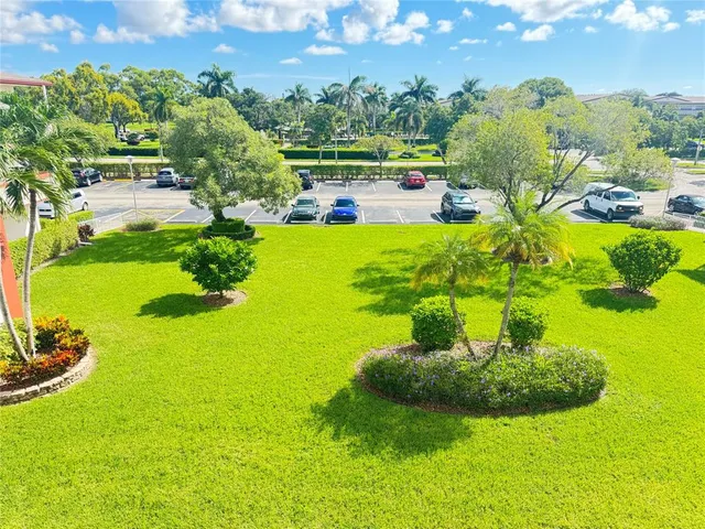 a view of a swimming pool with a yard