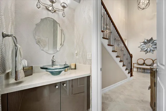 a bedroom with a bed a couch and a window