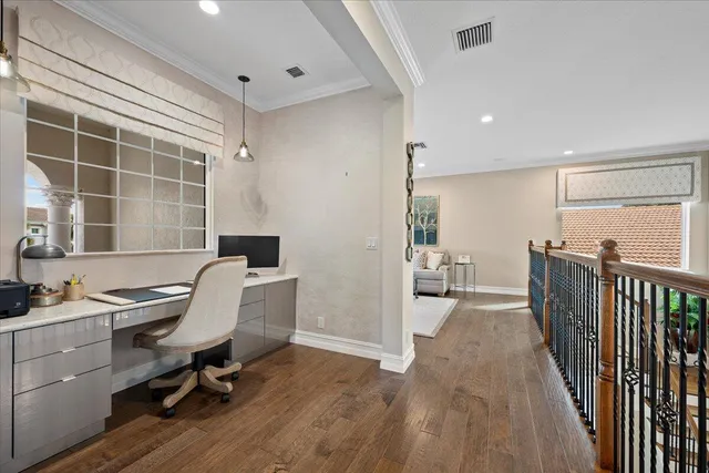 a view of a swimming pool with a garden and outdoor seating