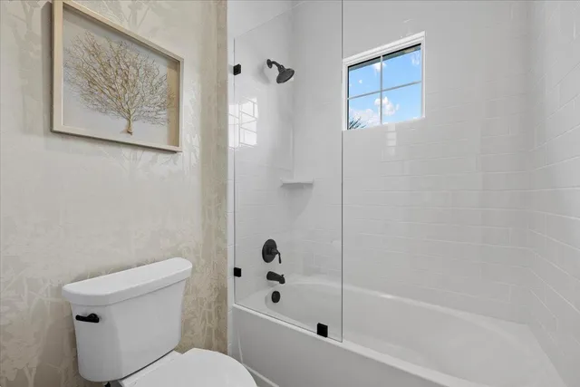 a view of house with swimming pool outdoor seating