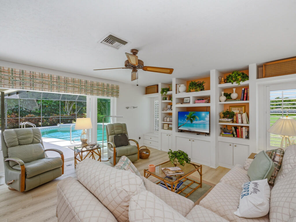 314 Torrey Pines Point Naples, FL 34113 - Photo 7 of 21 a living room with furniture and a large window