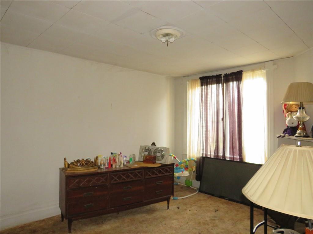 1214 Amanda Street Pittsburgh, PA 15210 - Photo 15 of 19 a bed room with furniture and window