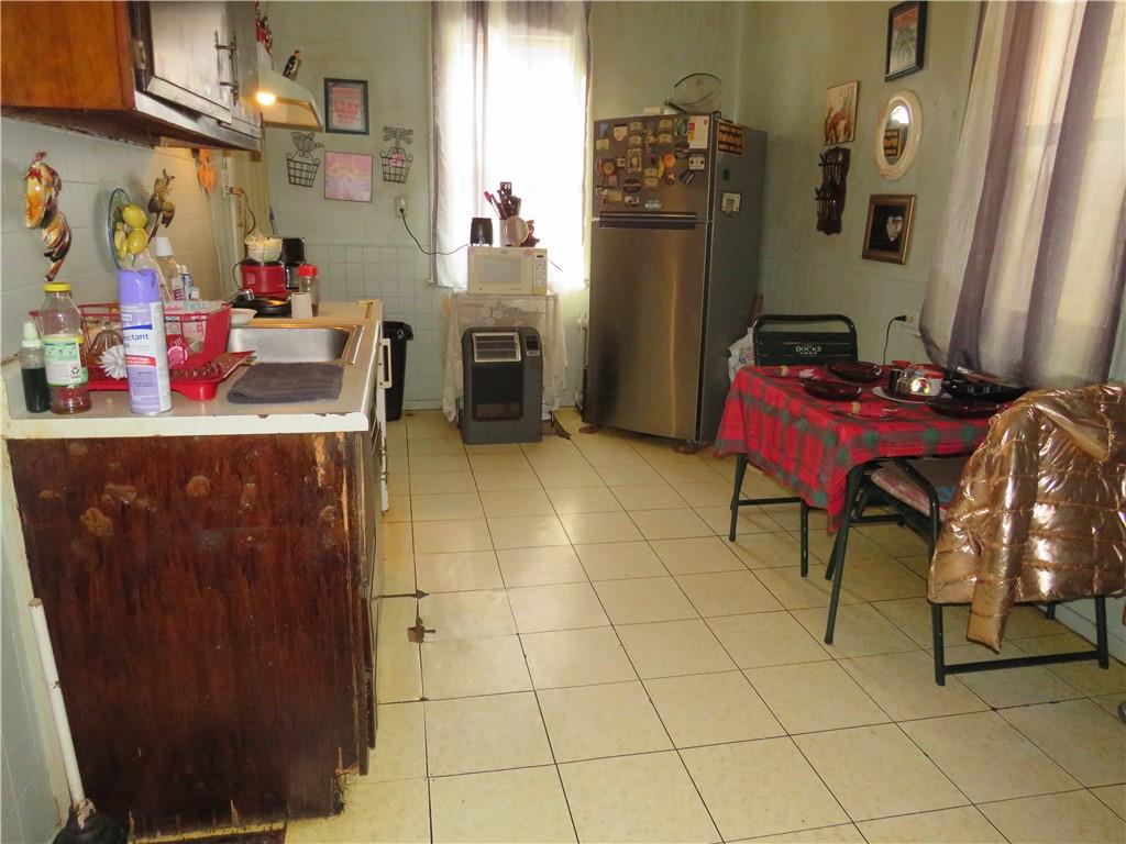 1214 Amanda Street Pittsburgh, PA 15210 - Photo 6 of 19 a kitchen with refrigerator and cabinets