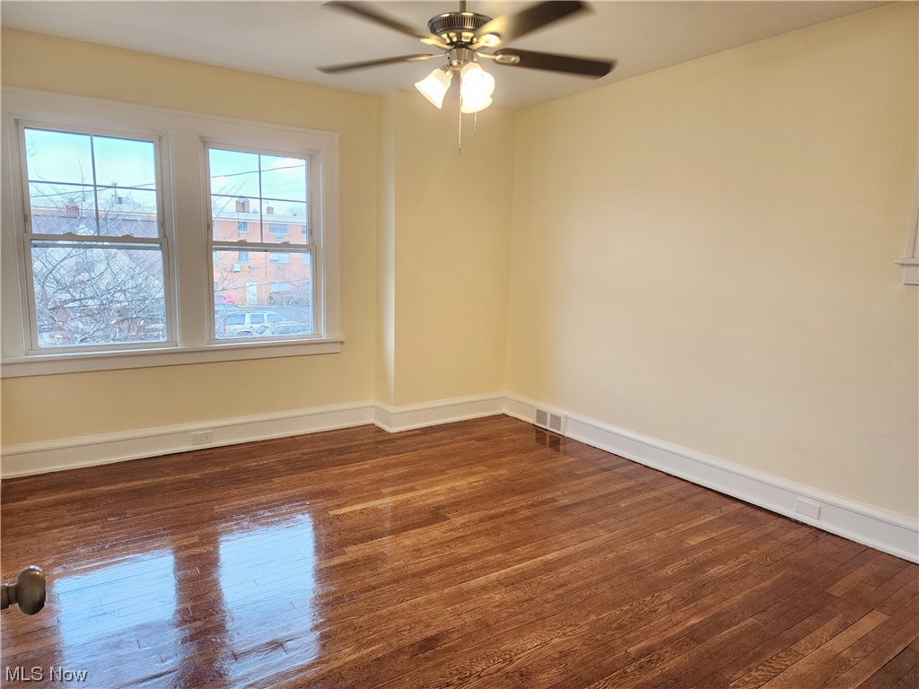 17814 Crestland Road Cleveland, OH 44119 - Photo 17 of 49 Empty room featuring dark hardwood flooring and ceiling fan