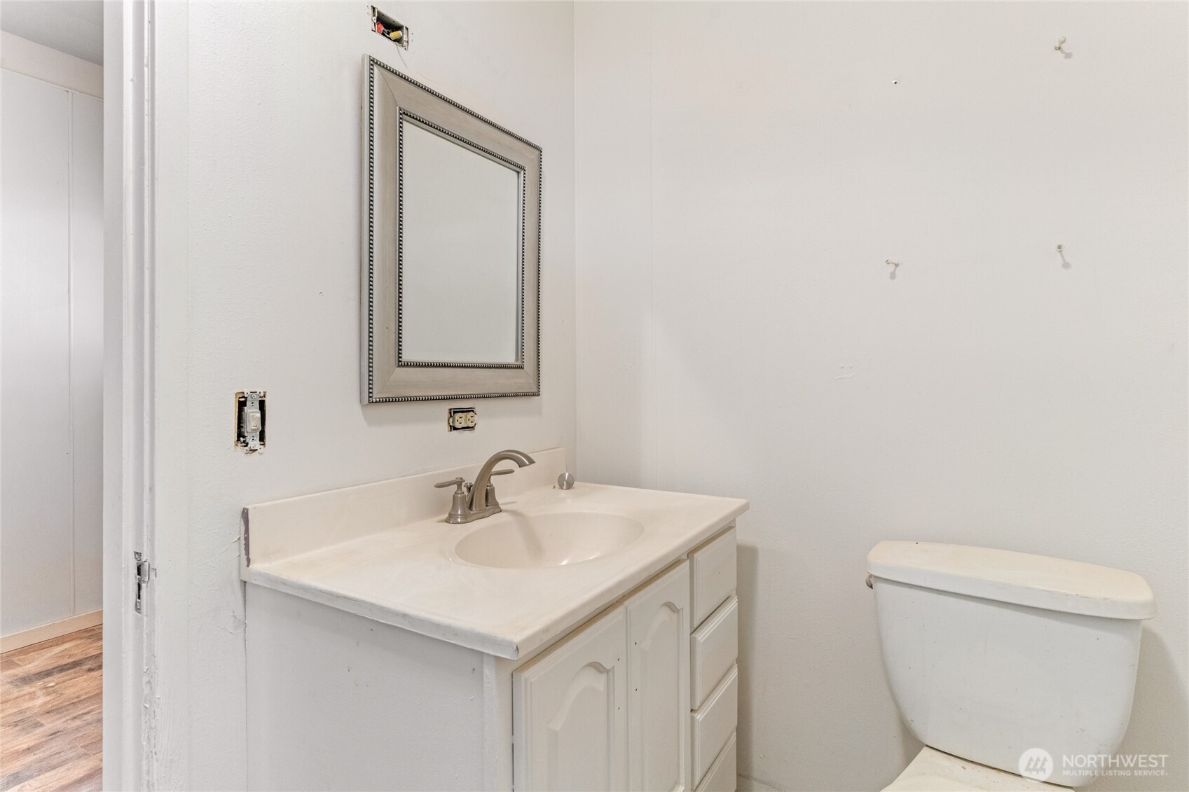 800 East Locust Street Waterville, WA 98858 - Photo 13 of 26 a bathroom with a toilet a sink and a mirror
