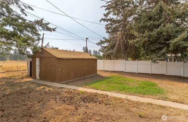a view of a house with a yard and garage