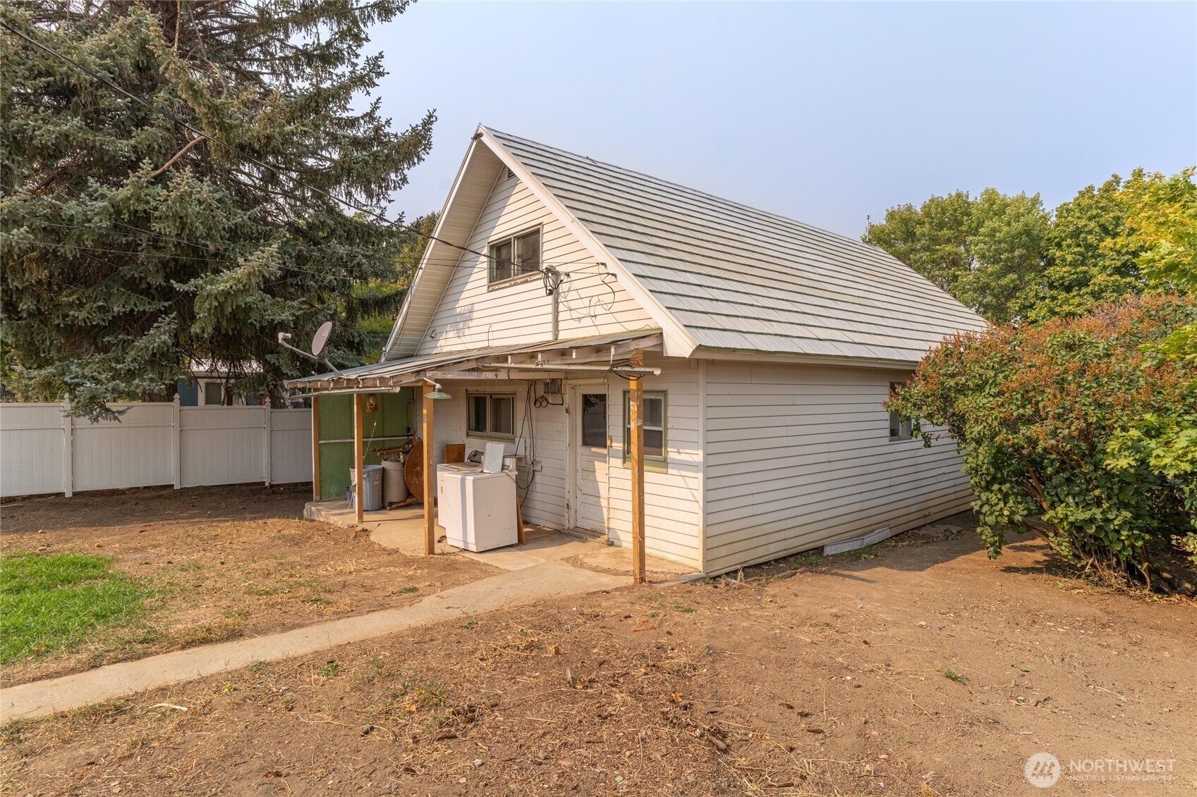 800 East Locust Street Waterville, WA 98858 - Photo 24 of 26 a view of a house with a yard and garage