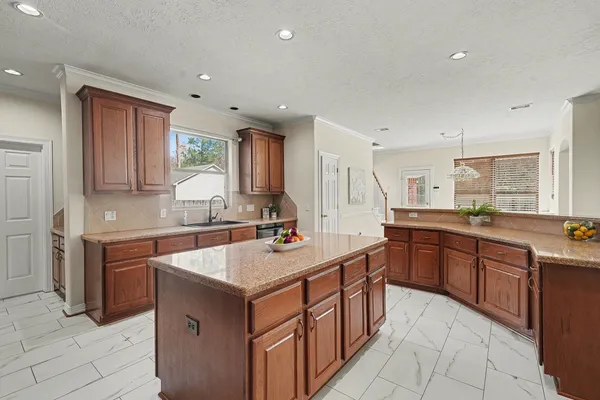 a kitchen with a sink stove and cabinets