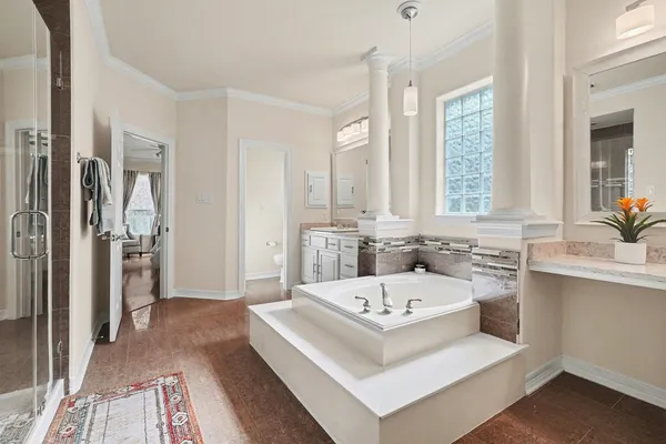 a bathroom with a sink a window and a mirror