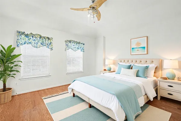 a bedroom with bed and a window