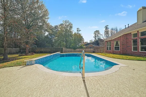 a view of a swimming pool with an outdoor seating