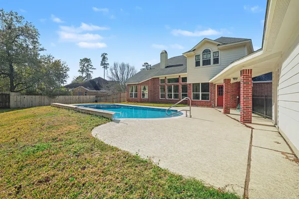 a view of a house with swimming pool