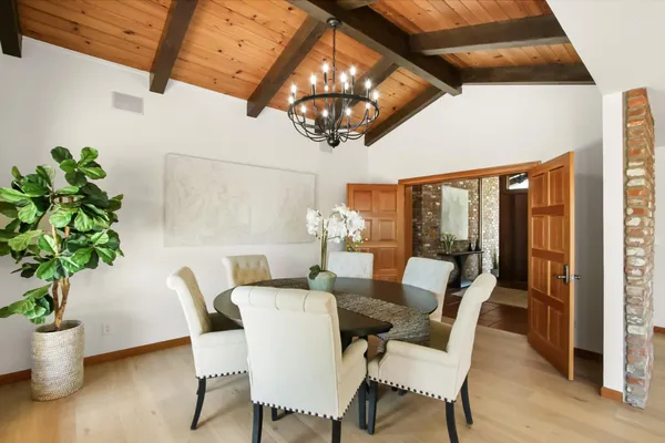 a living room with furniture large window and flat screen tv