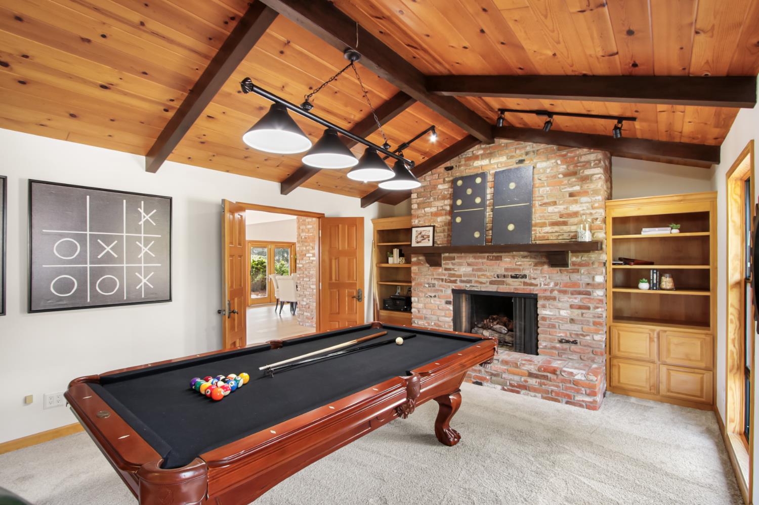 38385 Larue Way Davis, CA 95616 - Photo 19 of 89 a living room with furniture pool table and a fireplace