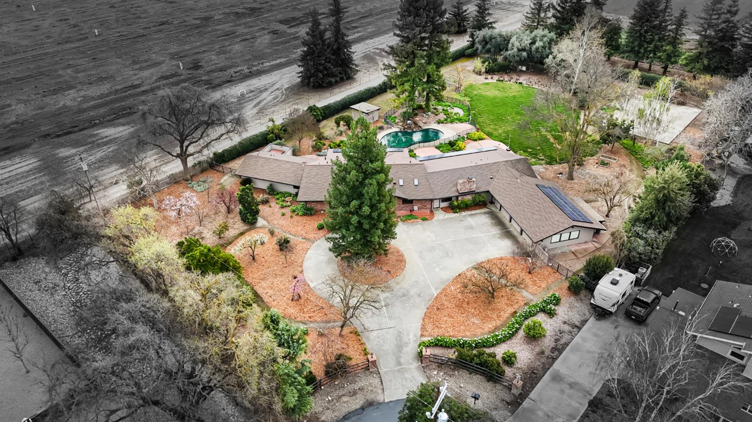 38385 Larue Way Davis, CA 95616 - Photo 2 of 89 an aerial view of a house with a yard and a large tree