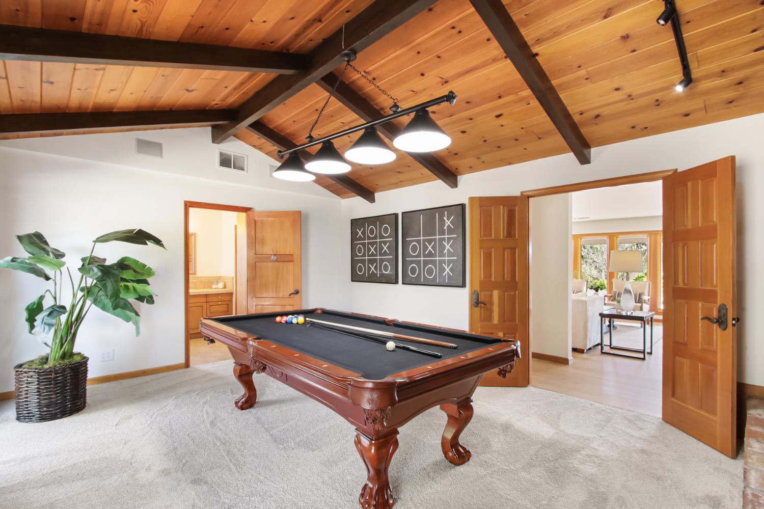 38385 Larue Way Davis, CA 95616 - Photo 21 of 89 a living room with a table tennis table and potted plant
