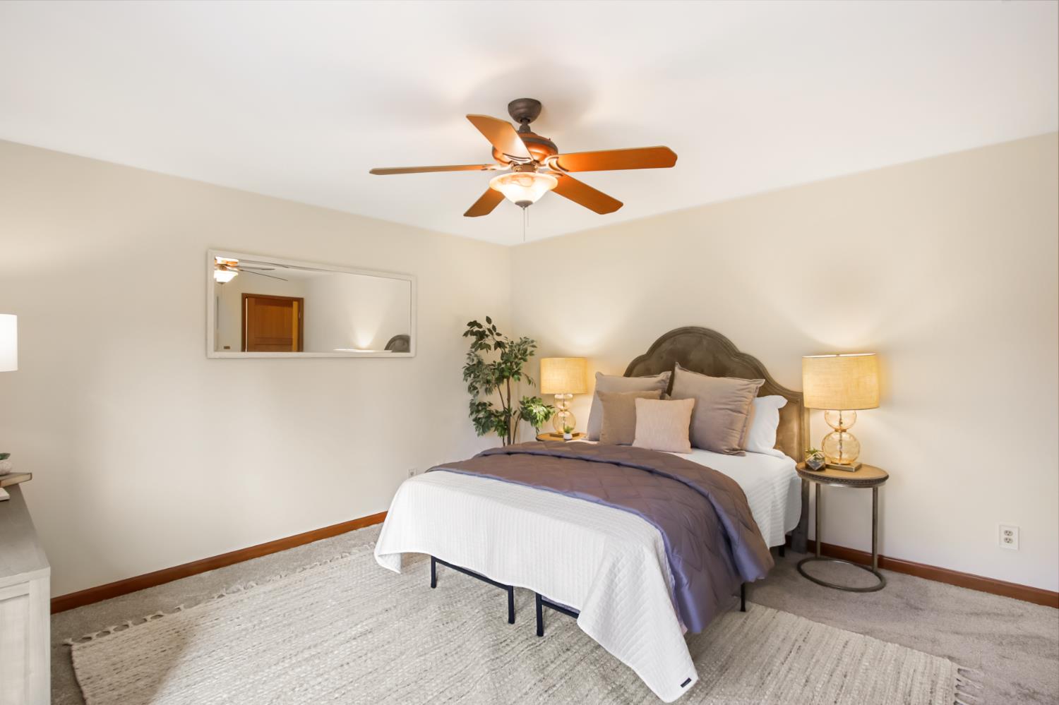 38385 Larue Way Davis, CA 95616 - Photo 53 of 89 a bedroom with a bed and a ceiling fan