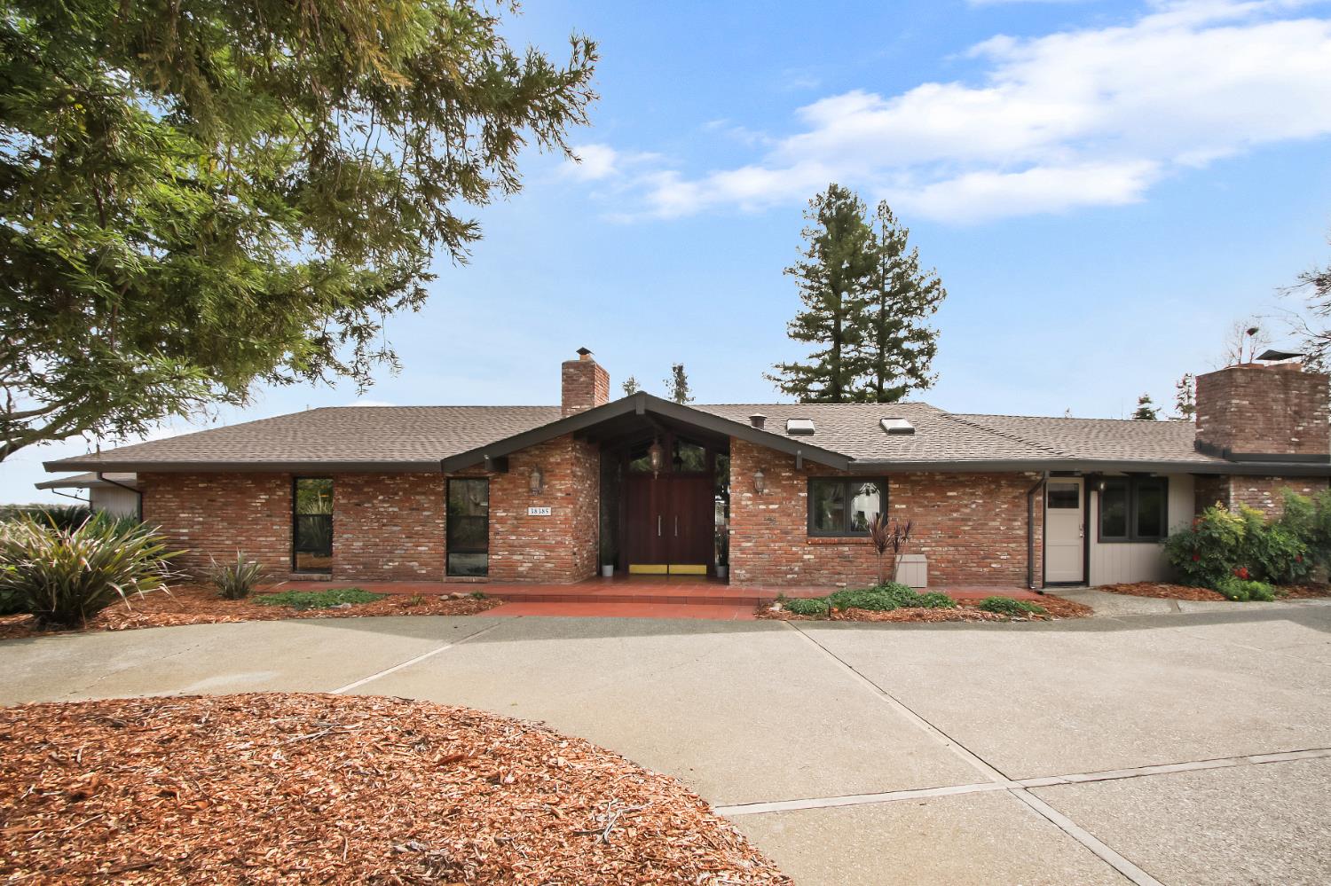 38385 Larue Way Davis, CA 95616 - Photo 6 of 89 a front view of a house with a yard