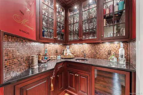 a kitchen with a sink and cabinets