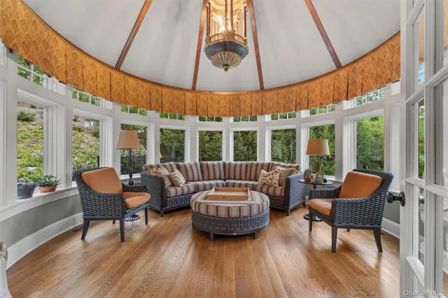 a living room with furniture a table and chairs