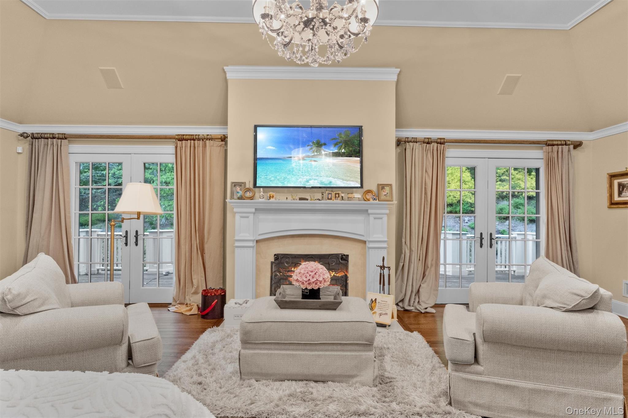7 Ridgeview Circle Armonk, NY 10504 - Photo 17 of 35 a living room with furniture a fireplace and a flat screen tv